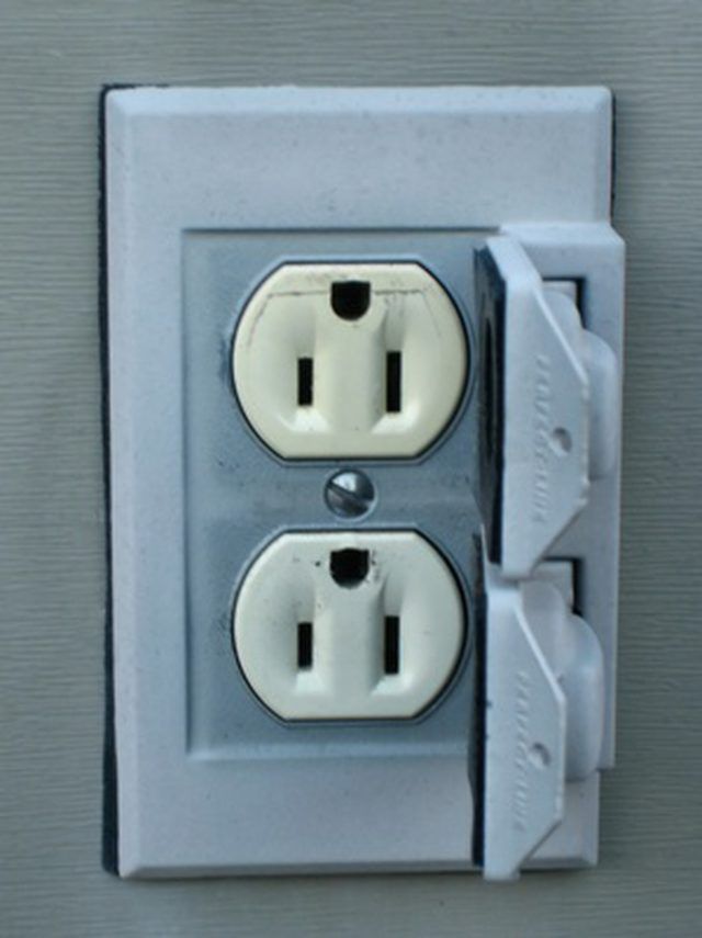 an electrical outlet with two white outlets