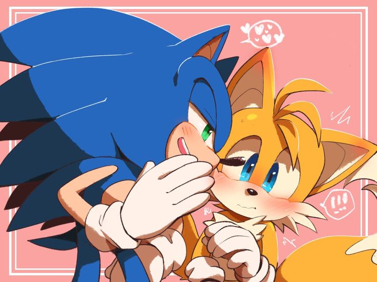 sonic and tails kissing each other in front of a pink background