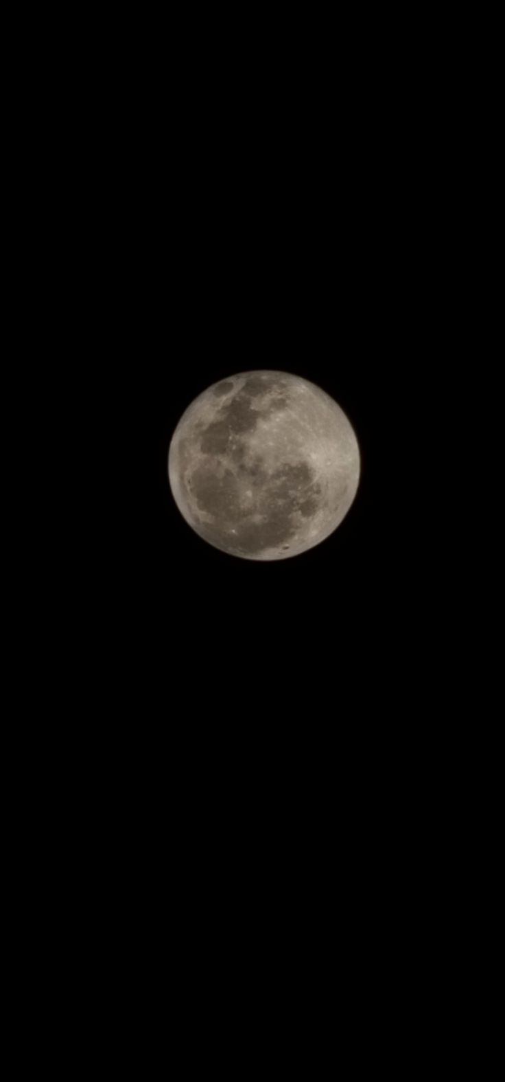 an airplane flying in the sky at night with a full moon behind it and black background