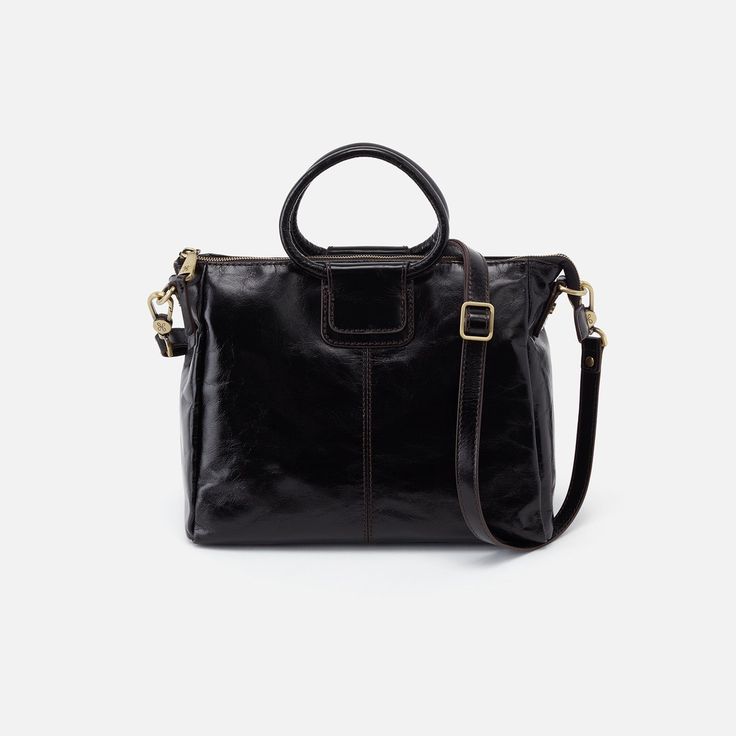 This mediumsized satchel makes for the perfect everyday bag when opting to travel light. Sheila Medium will soon be the bag youre always reaching for. Sheila Medium Satchel in Polished Leather  Black Satchel Bag in Black | Hobo® Black Satchel, Medium Handbags, Love Now, Black Purses, Travel Light, Top Grain Leather, Everyday Bag, Leather Satchel, Leather Top