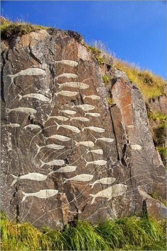 an image of rock art on the side of a mountain