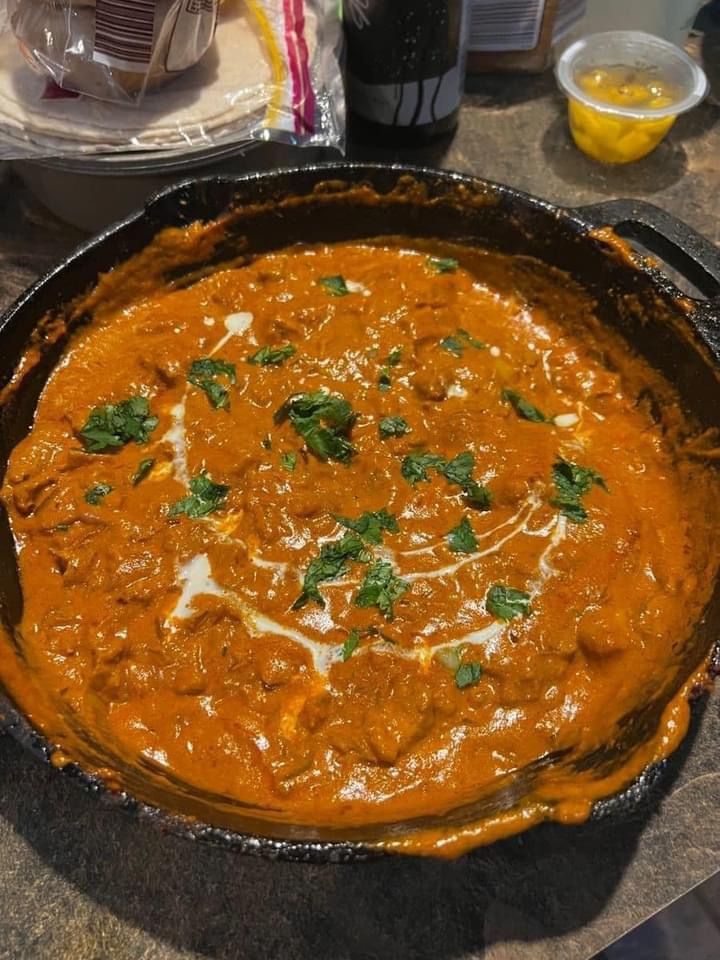 a pan filled with food sitting on top of a table