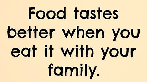 a sign that says food tastes better when you eat it with your family