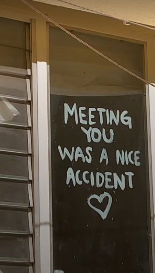 a sign that says meeting you was a nice accident on the side of a building