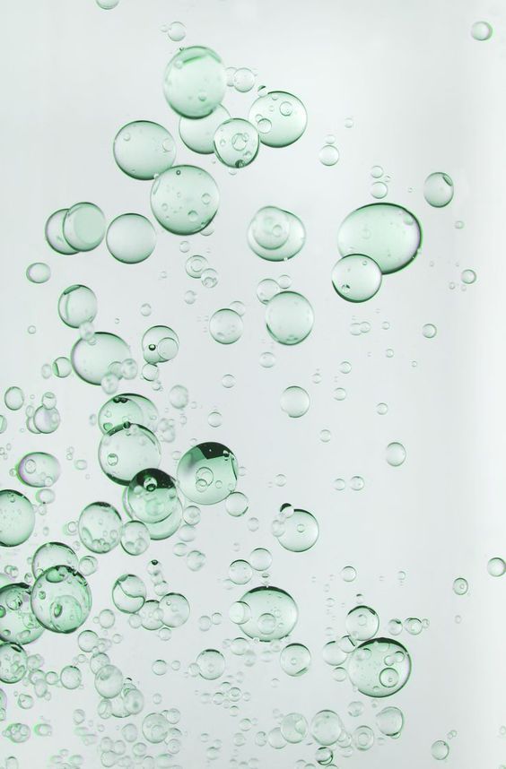 water bubbles floating in the air on a white background