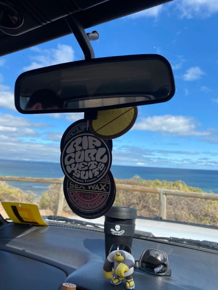 there is a car dashboard with some stickers on the dash board and in the back seat