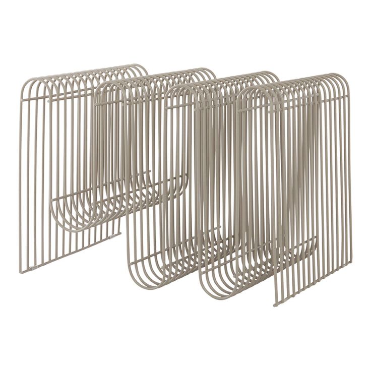 a set of three metal racks sitting next to each other