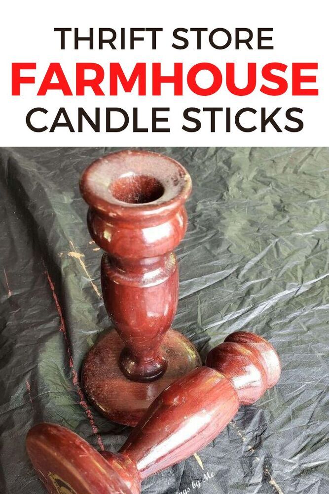 three red candlesticks sitting on top of each other with the words thrift store farmhouse candle sticks