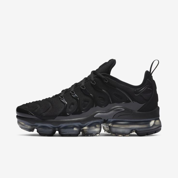 BLACKED-OUT AIR. The Nike Air VaporMax Plus looks to the past and propels you into the future. Made with at least 20% recycled material by weight, it keeps the future in mind while including design elements from the '98 Air Max Plus. Revolutionary VaporMax Air technology provides comfort and a modern look, while the floating cage, heel logo and iconic whale tail midfoot shank add heritage style. A sleek all-black upper and black rubber pods on the outsole show off your dark side. Benefits Origin Vapor Max Nike Women, Black Vapormax, Vapormax Plus Black, Nike Vapormax Plus, Vapormax Nike, Nike Vapor Max, Vapour Max Nike, Air Vapormax Plus, Nike Air Vapormax Plus