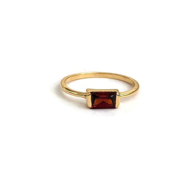 This is a Baguette Garnet Ring featuring a genuine garnet stone, this ring is available in sizes 5-8 and is crafted with a thick 3-micron gold vermeil Garnet Meaning, Garnet Engagement Ring, Green Tourmaline Ring, Bezel Earrings, Gemstone Drop Earrings, Garnet And Gold, Sparkle Necklace, Gemstone Beaded Necklace, Gold Filled Ring