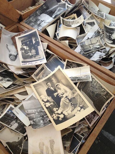 an old box filled with photos and papers