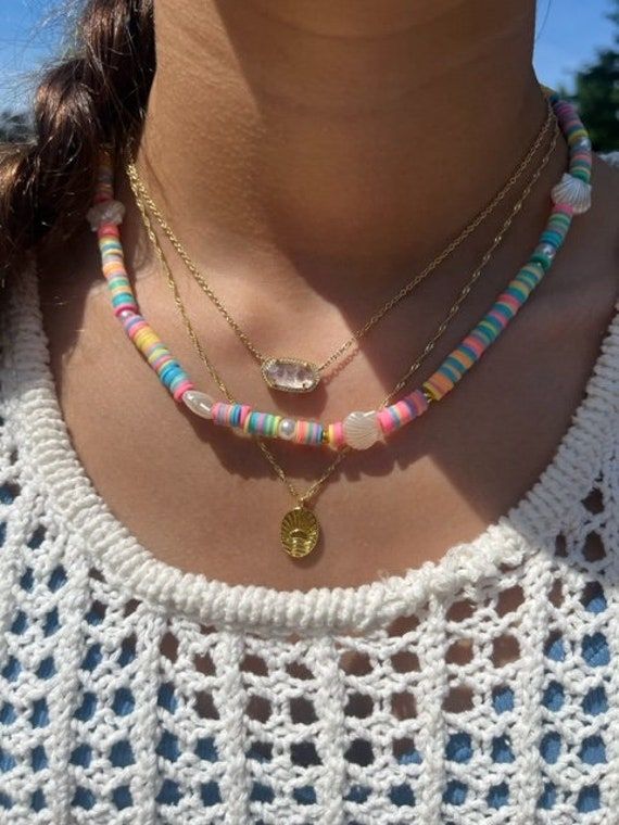 The cutest summer necklace to wear! It is so colorful and handmade with love. Handmade Playful Summer Necklaces, Playful Handmade Summer Necklaces, Multicolor Heart Beads Jewelry For Vacation, Fun Summer Necklaces With Round Beads, Fun Round Bead Necklaces For Summer, Pink Necklace For Summer Festivals, Colorful Bohemian Jewelry For Vacation, Playful Adjustable Necklaces For The Beach, Playful Summer Beach Necklaces