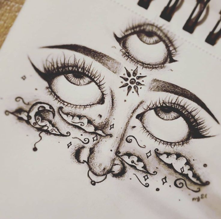 a drawing of an eye with long lashes and stars on the upper half of it