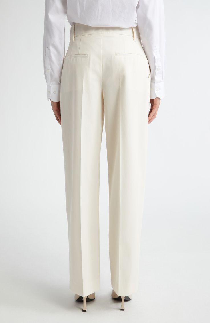 Topstitch detailing subtly calls out the classic lines of these pleat-front trousers made from sturdy, seasonless stretch wool. 30" inseam; 21" leg opening; 10" front rise; 13" back rise (size 10) Zip fly with hook-and-bar closure Belt loops Lined 100% organic cotton Hand wash, line dry Made in the USA Women's Designer Clothing Tailored White Pants With Pressed Crease, Cream Trousers With Pressed Crease, White Straight Dress Pants With Pressed Crease, White Dress Pants With Pressed Crease, Cream Straight Hem Bottoms For Work, Cream Wide Leg Dress Pants For Formal Occasions, Cream Workwear Pants With Pressed Crease, Formal Cream Pants With Straight Hem, Cream Pants With Pressed Crease For Work