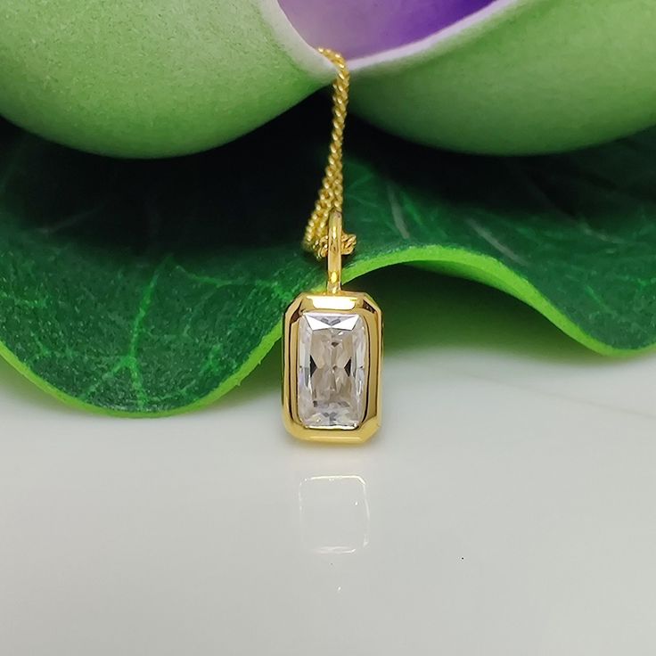 This elegant pendant features a 1.67-carat radiant-cut moissanite solitaire, showcasing its brilliant sparkle. The gemstone is bezel-set in 14k yellow gold, offering a secure and sleek design. This minimalist piece combines timeless charm with contemporary simplicity, making it a perfect accessory for women seeking a classic yet modern look. Bezel Set Moissanite Pendant 1.67 CT Radiant Cut Moissanite Solitaire Classic Pendant, 14k Yellow Gold Charm Minimalist Pendant For Womens Moissanite Pendan Radiant Cut Solitaire Necklace For Gift, Rectangular Yellow Gold Moissanite Jewelry, Square Cut Moissanite Jewelry For Gifts, White Rectangular Moissanite Jewelry, Rectangular White Moissanite Jewelry, Rectangular Moissanite Jewelry As A Gift, Modern Radiant Cut Jewelry For Gifts, Rectangular Gold Moissanite Jewelry, Rectangular Moissanite Gold Jewelry