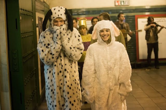 two people in costumes standing next to each other