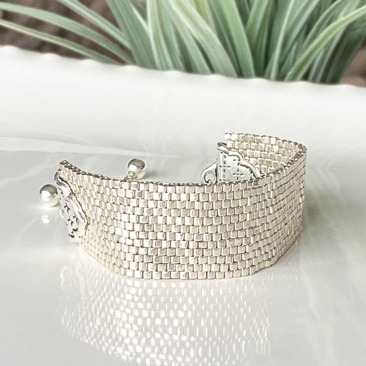 Adjustable Jubilee Cuff Bracelet With Round Beads, Adjustable Nickel-free Modern Beaded Bracelets, Handmade Adjustable Silver Cuff Bracelet, Adjustable Handmade Silver Cuff Bracelet, Elegant Adjustable Woven Bracelets, Elegant Woven Adjustable Bracelets, Modern Handmade Silver Beaded Bracelets, Adjustable Silver Cuff Bracelet With Beads, Adjustable Silver Modern Beaded Bracelets