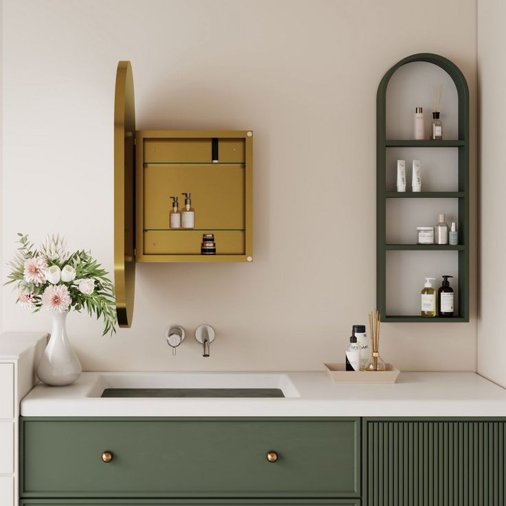 a bathroom sink sitting under a mirror next to a green cabinet