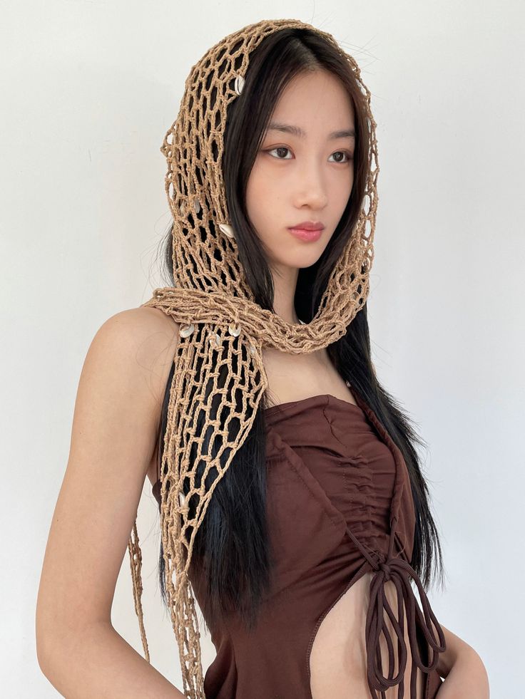 Unveil the essence of bohemian charm with our Crocheted Mesh Shawl Wrap, a versatile accessory that seamlessly marries form and function. Crafted with intricate crocheted mesh, this wrap exudes a handcrafted appeal, giving it an organic texture that is both appealing to the touch and a delight to the eye. Its triangular cloak shape ensures it drapes effortlessly over any outfit, elevating your look with a touch of boho style. The multifunctional design enables you to style it as a shawl, wrap sk Crochet Mesh Headband, Avant Garde Crochet Fashion, Crochet Mesh Shawl, Crochet Rennaisance Faire, Festival Crochet Outfit, Crochet Pashmina, Crochet Mesh Pattern, Crochet Rave Outfit, Rave Crochet