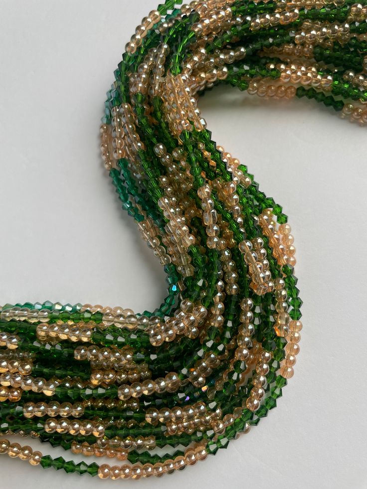 Elastic waist beads are a cherished part of Ivory Coast heritage, symbolizing femininity, sensuality, and personal growth. These beads celebrate life's significant moments and empower women to embrace their unique journeys with grace and confidence. Design and Craftsmanship: Materials: Premium crystal glass seed beads Colors: Deep Green: Evokes growth, harmony, and a sense of renewal Sandy Brown Accents: Reflect warmth, stability, and a grounded elegance Fit: Elastic band ensures a comfortable, Bids Jewellery, Cheap Bohemian Waist Beads For Women, Green Waist Beads, Waist Beads Outfit, Waist Beads African, African Origins, Waist Jewelry, Diy Furniture Easy, Earthy Outfits