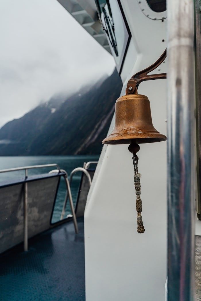 a bell hanging from the side of a boat