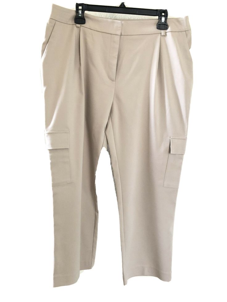 Calvin Klein Straight Leg Cargo Pants  Beige Late style K02PB831 MSRP $79.50 Sz 14 the  two back pockets are only for decoration  it has two on the top side and two mid leg New with original tag  Measurements are taken laying flat  waist - 19" in. inseam - 27 " in. Length - waist to hem -37" in. 4 pocket  Please see all pictures for more details on item. Comes from a smoke and pet free environment. Thank you for looking. Beige Workwear Pants With Flap Pockets, Calvin Klein Relaxed Fit Straight Leg Bottoms, Fitted Beige Pants With Patch Pockets, Fitted Beige Pants With Pockets, Beige Workwear Bottoms With Flap Pockets, Beige Workwear Pants With Side Pockets, Beige Work Pants With Side Pockets, Fitted Beige Pants With Side Pockets, Spring Pants With Flap Pockets