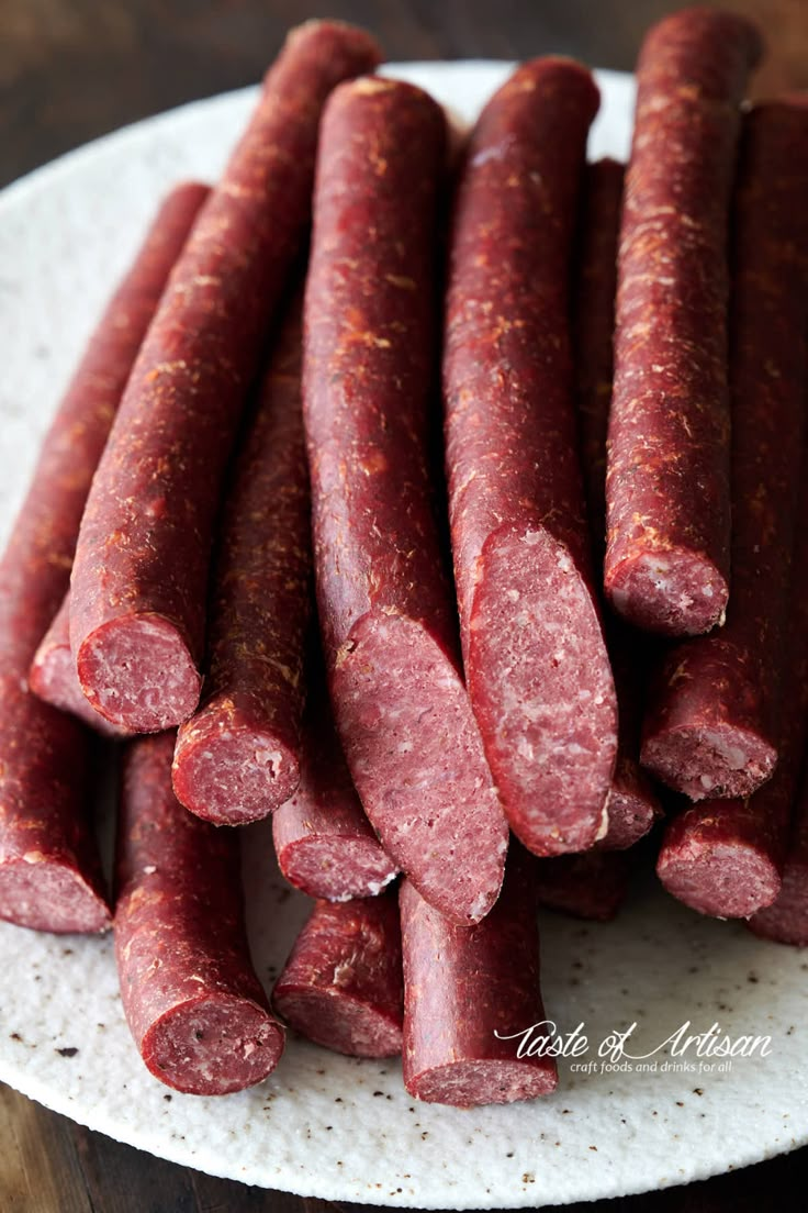 several sausages on a plate ready to be cooked