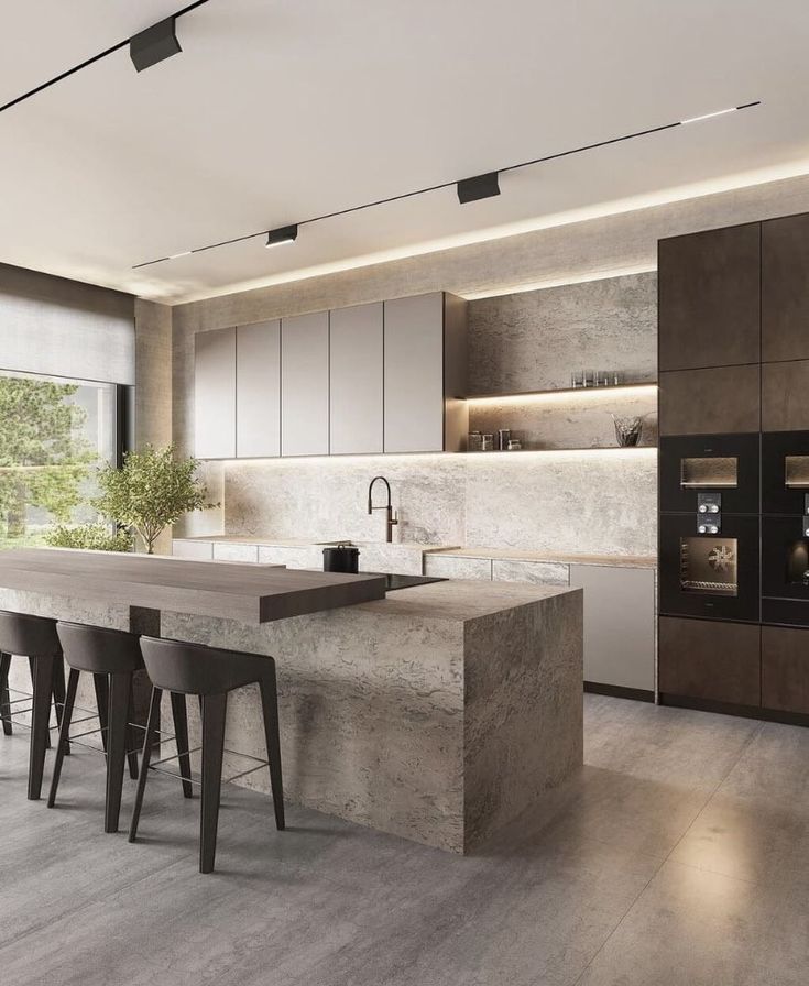 a modern kitchen with marble counter tops and bar stools