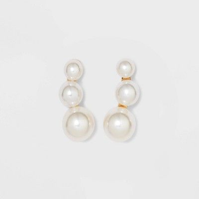 These Pearl Gold Stud Earrings from A New Day™ are a timeless addition to your jewelry collection and a lovely gift for a friend or family member. This stud earring pair features a gold-tone curved bar encrusted with three milky white faux pearls with graduated spherical shapes. Helping to add a polished finishing touch to any outfit, these lightweight earrings come with post-back closures to offer a secure, comfortable fit.

A New Day™: Style that goes wherever you do. Buy Pearls, Curved Bar, Xmas List, School Dances, Gold Stud Earrings, Lightweight Earrings, Jewellery Storage, Milky White, Wedding Hair And Makeup