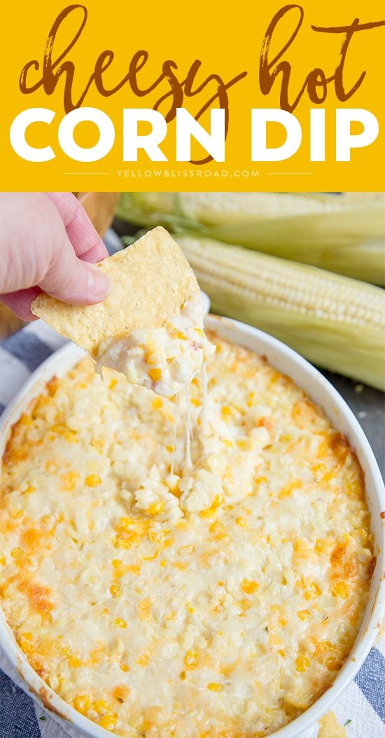 a cheesy hot corn dip in a white bowl