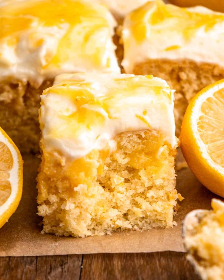 there is a piece of cake with icing and oranges