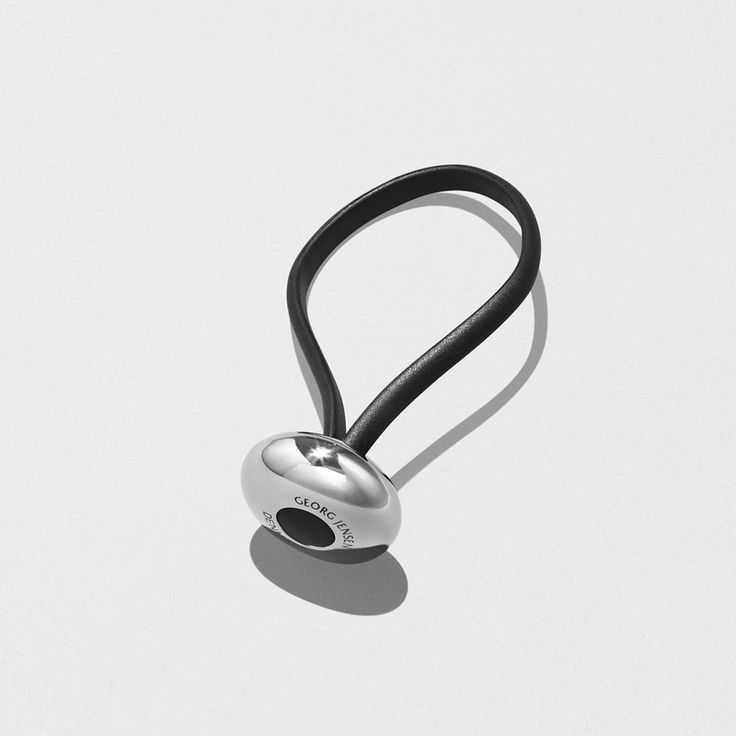 Key rings serve a very practical purpose - to keep your keys together and make them easier to find in a bag or pocket - but they also evoke a sense of security and responsibility. The Ellipse key ring has an uncomplicated but very tactile quality - an unfussy, simple mechanism and shape but one that feels nice in your hand. The contrast between the smooth metal fob and the soft strap gives the key clip its own special appeal. Designer Klaus Rath has a background in industrial design and is fasci Key Organizer, Beautiful Gift Wrapping, Key Clip, Cameo Pendant, Georg Jensen, Car Keychain, Gift Packs, Flatware Set, Jewelry Inspo