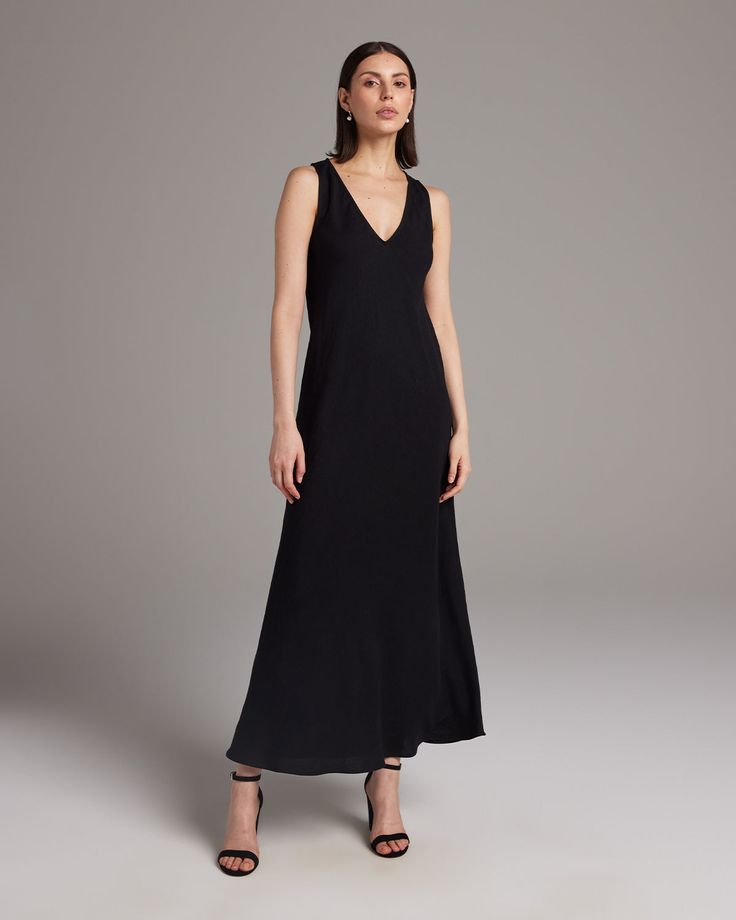 Make an effortless statement with our soft linen maxi dress. The lightweight linen blend makes this the perfect piece for a relaxed warm-weather look. Pair with the Linen Featherlight Blouse or Loose Knit Linen Sweater. 55% Linen, 45% Rayon Made in New York City Elegant Linen V-neck Maxi Dress, Formal Linen Maxi Dress, Casual Viscose Maxi Dress For Evening, Casual Evening Maxi Dress In Viscose, Classic V-neck Maxi Dress For Summer, Classic Summer Maxi Dress, Bias Cut Maxi Dress For Daywear, Sleek V-neck Maxi Dress For Spring, Classic Black Maxi Dress For Spring