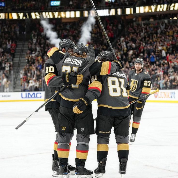 the hockey team is congratulating each other on the ice