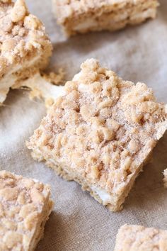 several pieces of cake sitting on top of a piece of parchment paper with crumbs all over it