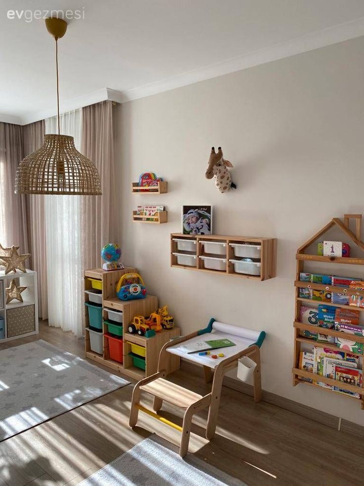 a child's room with toys and bookshelves on the wall