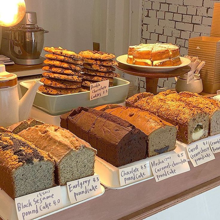 breads and pastries on display at a bakery