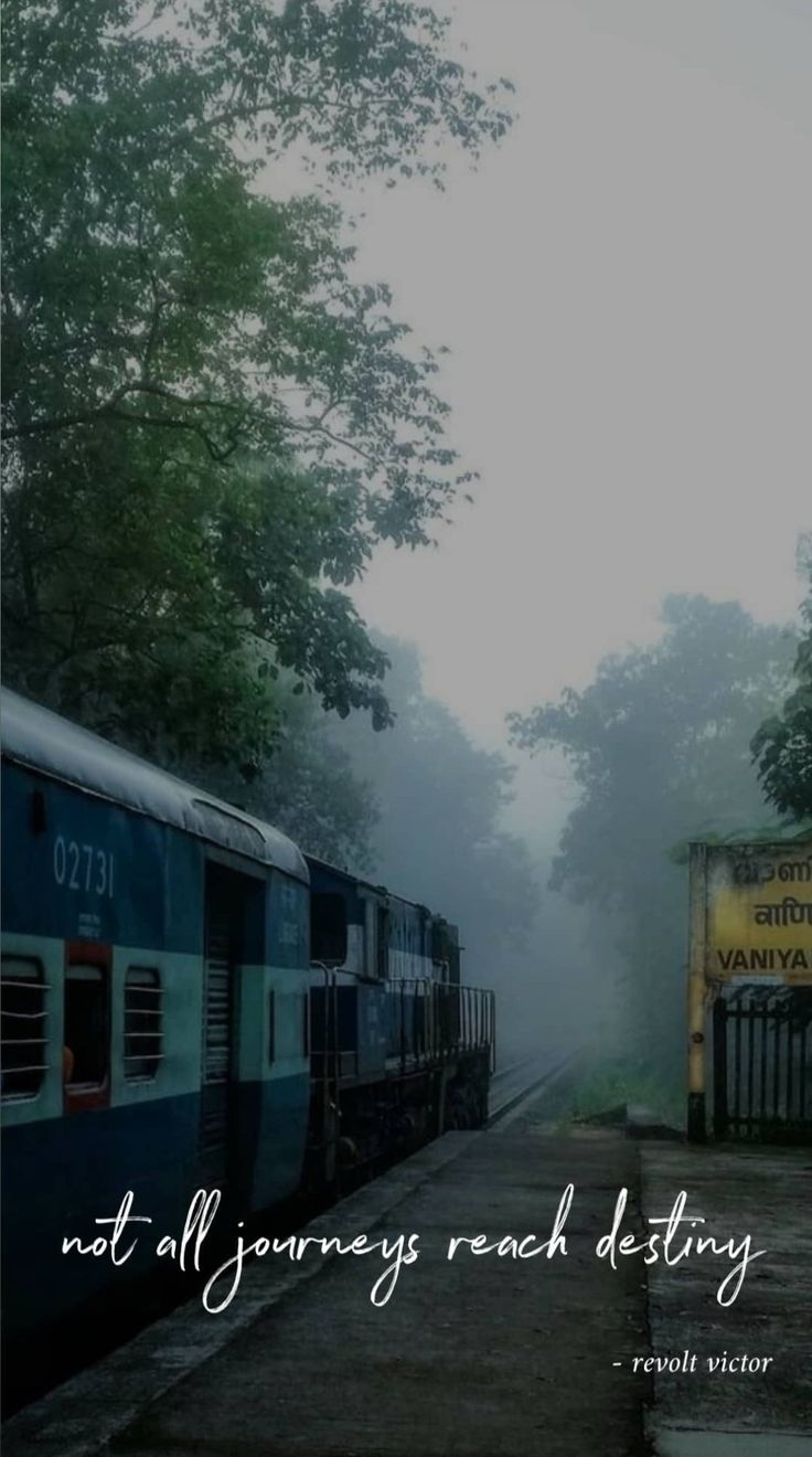 two trains parked next to each other on train tracks in the foggy forest with a quote about not all journey reaching