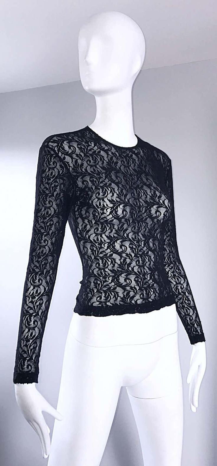 For Sale on 1stDibs - Sexy vintage 90s CALVIN KLEIN black lace cropped top shirt ! Features a fine soft lace that stretches to fit. Tailored body, with sleek long sleeves. Looks Fitted Calvin Klein Crew Neck Top, Calvin Klein Fitted Crew Neck Top, Black Lace Tops For Party, Black Lace Party Tops, Elegant Cropped Top With Delicate Lace, Black Lace Top With Crew Neck, Fitted Top With Lace Sleeves For Night Out, Evening Lace Tops With Stretch, Fitted Crew Neck Lace Top