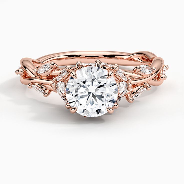 a rose gold engagement ring set with an oval center stone surrounded by small round diamonds