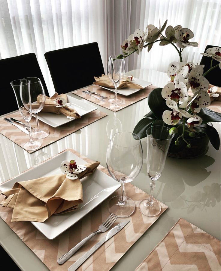 the table is set with place settings for four