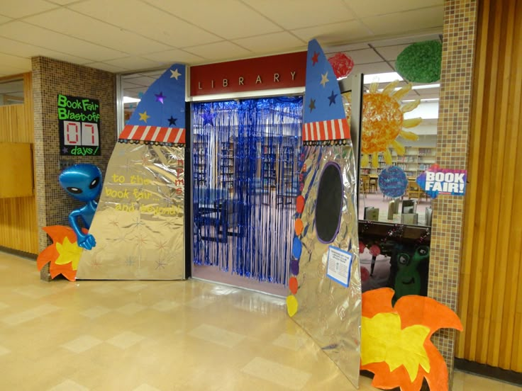 the inside of a library decorated with paper machs and decorations for children's books