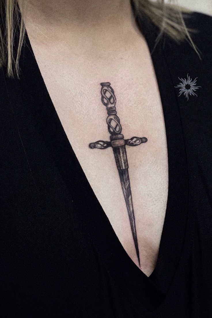 Chest Knife Tattoo, Knife Chest Tattoo Female, Knife Between Chest Tattoo, Sternum Knife Tattoo, Dagger Tattoo Chest Woman, Knife Tattoo Chest, Swords Chest Tattoo, Celtic Dagger Tattoo, Swords Sternum Tattoo