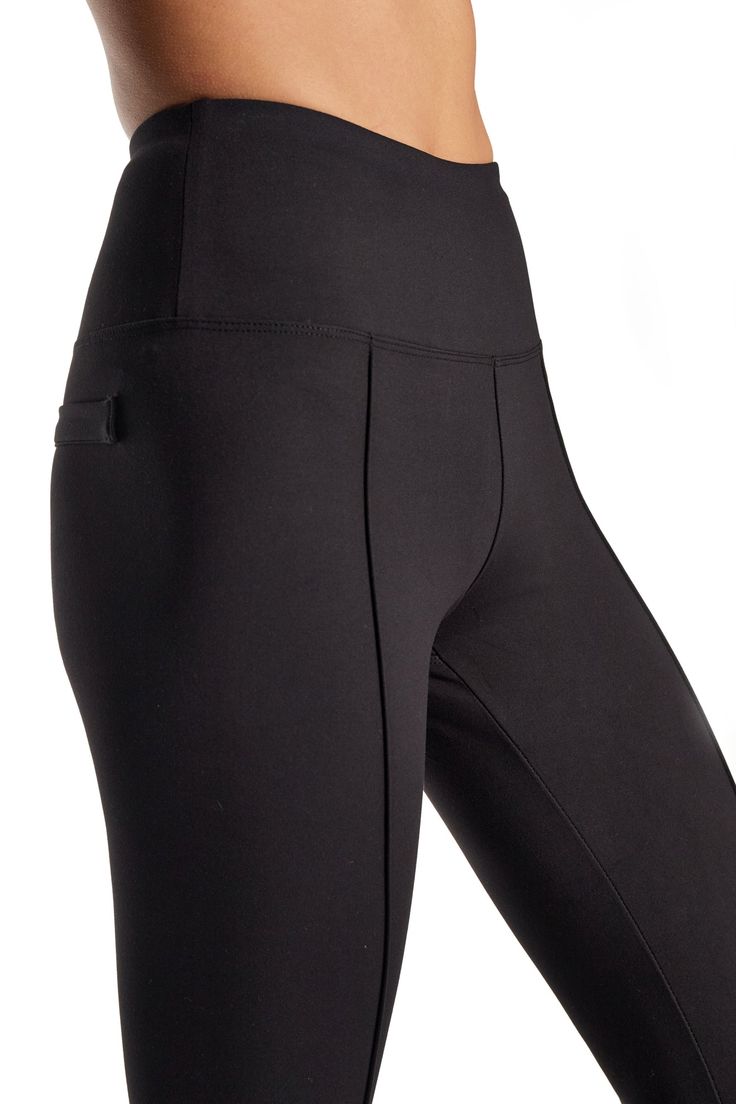 Elevate your style with our High Waist Interlock Trouser, featuring exquisite front pin-tuck detailing for a touch of sophistication. The high waist design not only flatters your silhouette but also ensures a modern and on-trend look. Embrace the tailored elegance with two faux back welt pockets, adding a refined finish to these versatile trousers. Perfect for both professional and casual settings, our High Waist Interlock Trouser seamlessly combines comfort with elevated fashion. Redefine your Elegant Solid Bottoms With Contoured Waistband, Elastane Leggings With Wide Waistband, Elegant Solid Bottoms With Wide Waistband, Modern Fitted Solid Bottoms, Chic Black Bottoms With Seam Detailing, Solid Color Pants With Seam Detailing, Elegant High Waist High Stretch Pants, Elegant Fitted Pants With Wide Waistband, Elegant High Waist Stretch Leggings