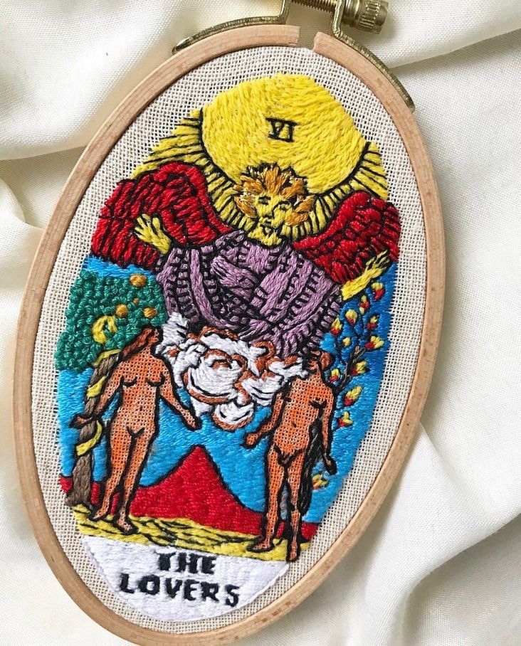 an embroidery project with the words, the lovers and two angels on it's back