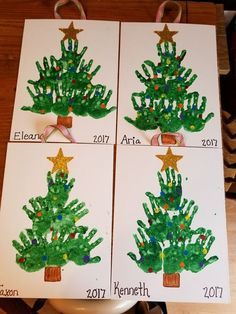 four handprinted christmas trees on white cards