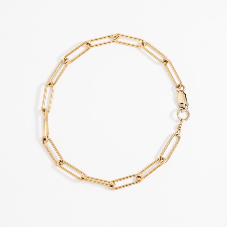 "This substantial paperclip chain bracelet is a delicate but sturdy addition to your everyday jewelry collection. Perfect for layering with other bracelets. View the smaller version here : https://www.etsy.com/listing/777429412 We recommend choosing a length that is between .75\" and 1\" larger than your exact wrist size. If you need a special size please reach out to us or specify it in the notes at checkout! * Chain links approximately 13mm. * Materials : 14k gold filled or sterling silver. * 14k Gold Rectangular Paperclip Chain Bracelet, 14k Gold Link Paperclip Bracelet, Gold Paperclip Box Chain Bracelet, Dainty Paperclip Bracelet With Solid Links, Everyday Minimalist Paperclip Bracelet With Lobster Clasp, Dainty Solid Link Paperclip Bracelet, Minimalist Formal Paperclip Chain Bracelet, Minimalist Rectangular Chain Bracelet For Everyday, Classic Paperclip Chain Link Bracelet With Lobster Clasp