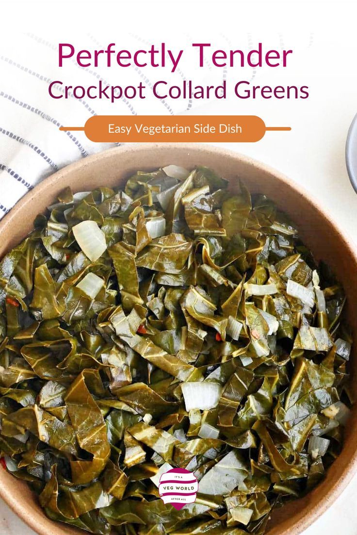 a bowl filled with cooked collard greens on top of a table