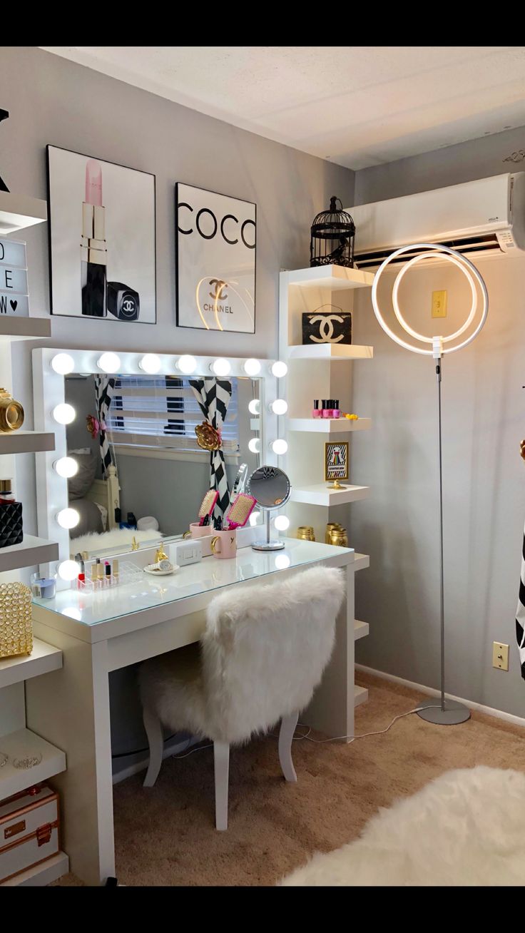 a white desk topped with a mirror and lights