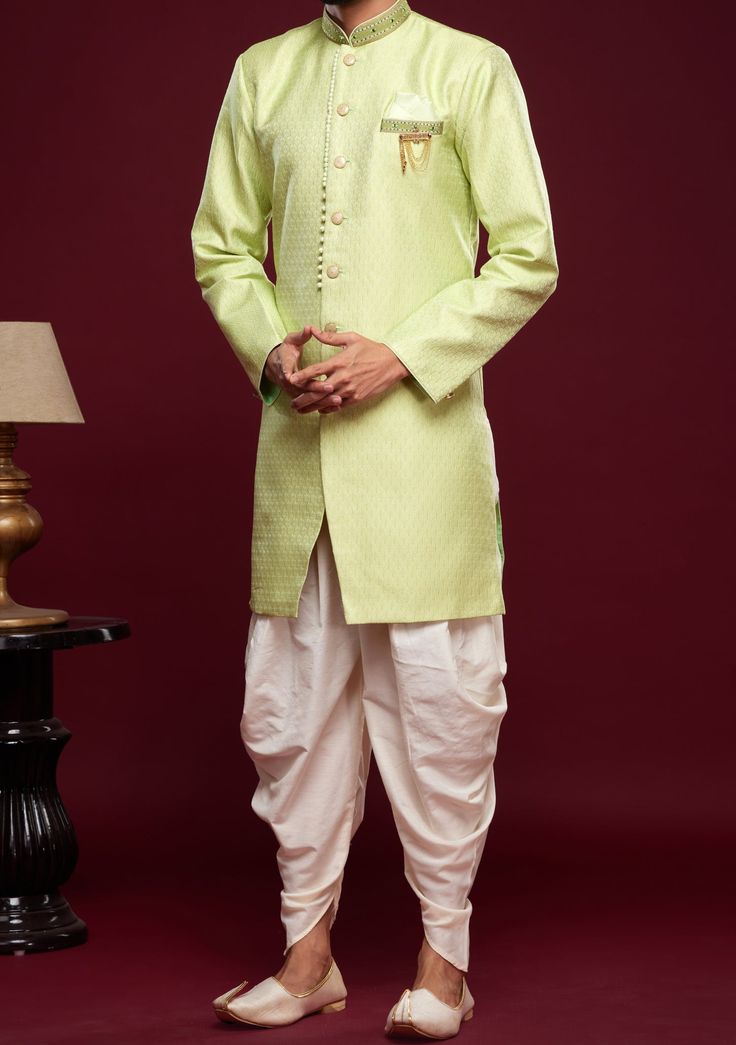 Ready-Made Sherwani With Peshawari Trouser. All Over Jacquard Brocade Style Fabric Top. Art Silk Peshawari Ready Made Trouser. Crafted in Chinese Collar Neck, and Full Sleeve. Satin Lining with Plain Work. High-Quality Matching Buttons. Please Note: The footwear shown in the picture is for presentation and photography purpose only. Color: There might be slight color variation due to lightings and flashes while photo shooting. The color may also vary because of different screen resolutions. Wash Western Party Wear, Indo Western Sherwani, Western Party, Western Parties, Chinese Collar, Readymade Saree, Collar Neck, Top Art, Indo Western